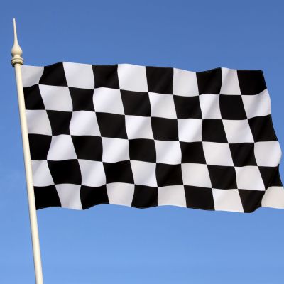 Checkered flag with a black-and-white checkered pattern displayed at the end of a race.