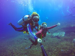 Underwater scuba diving selfie shot with a selfie stick in the Adriatic Sea.